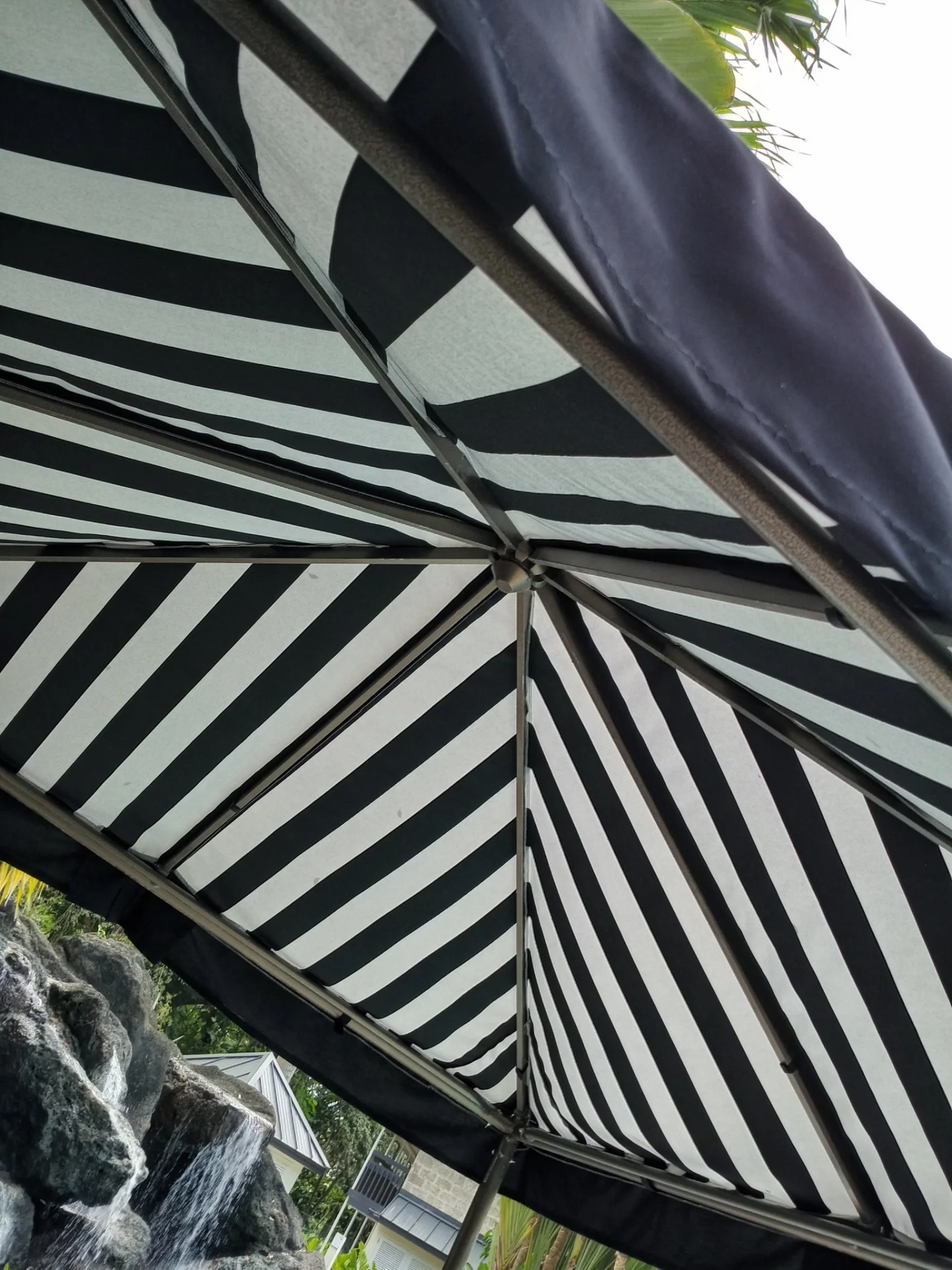 Striped canvas market umbrella canopy fabricated by Hinds Upholstery Barbados