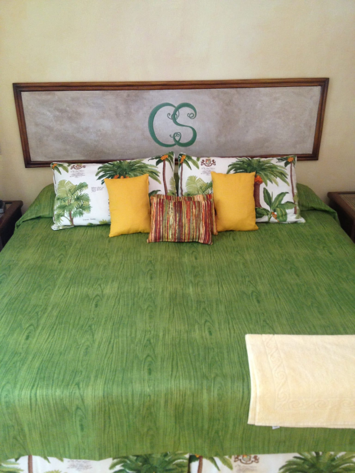 Custom bedspread, bolsters and palm-print cushions made by Hinds Upholstery in Barbados